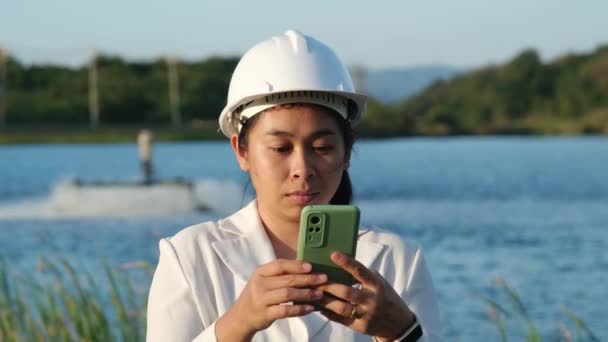 Environmental Engineer Wearing White Helmet Uses Mobile Phone Record Data — Video Stock