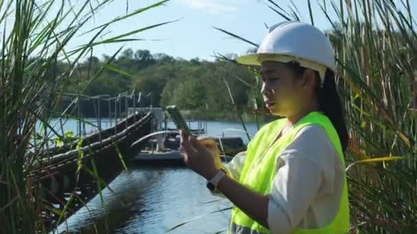 Environmental Engineer Uses Mobile Phone Take Pictures Record Data Analyzing — Stockvideo