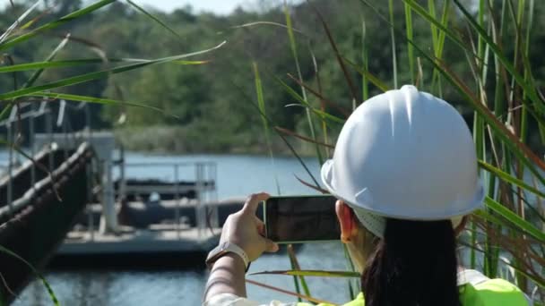 Environmental Engineer Uses Mobile Phone Take Pictures Record Data Analyzing — Stock Video