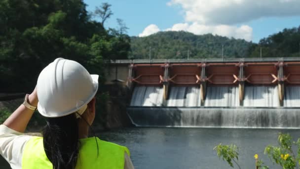 Female Engineer Wearing Green Vest White Helmet Working Dam Hydroelectric — Stock video