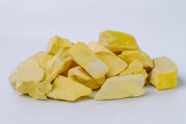 Freeze-dried durian, is a processed fruit that retains the nutritional value of food. A pile of freeze-dried durians isolated on white background. Clipping path.