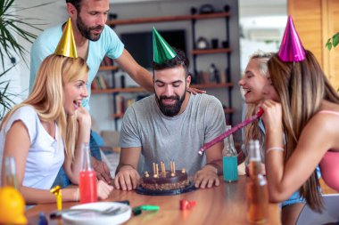 Group of friends celebrating birthday at home. Party, holidays,happiness and people concept.