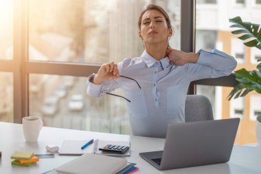 Businesswoman working in the office.Frustrated stressed business woman in office.