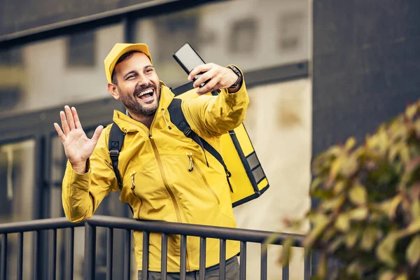 Photo of man from delivery service using phone. Fast delivery service concept.