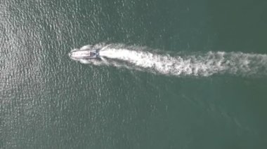 Ariel view of coast guard powerboat cruising in high speed. Speedboat border guard patrol the sea.