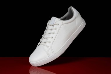 Running sport shoe on black background. Running shoe, sneaker or trainer. White shoe. fitness, sport, training concept.