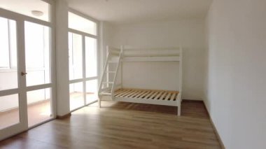New children rooom with bunk bed. New home. Interior photography. Wooden floor.