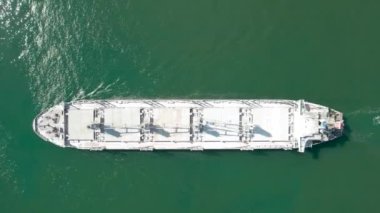 Aerial top down view of rdry cargo ship floats. Ship logistic and transportation business industry.