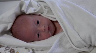 Baby vomiting close up view.  Baby Girl Vomit, after breast feeding time