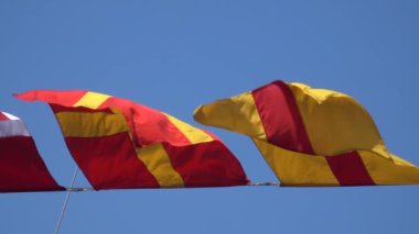 Various nautical flags tied together with rope, Ship flags signals, morse code,