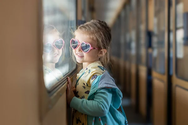 Cute Little Girl Sunglasses Staring Window Train Journey Girl Looks — Stock Photo, Image
