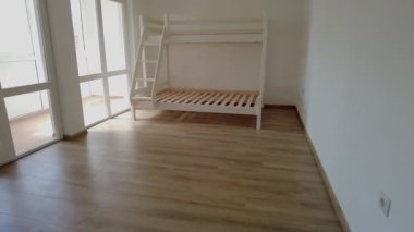 New children rooom with bunk bed. New home. Interior photography. Wooden floor.