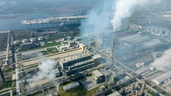 Chemical factory with smoke. Chemical plant. Industrial power plant with smokestack