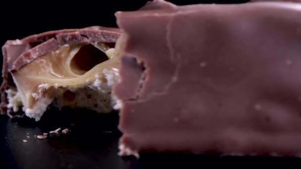 Close Chocolate Candy Bar Caramel Filling Snapped Half — Stock Video