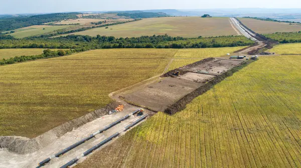 stock image Aerial view of gas and oil pipeline construction. Pipes welded together. Big pipeline is under construction.