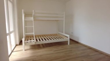 New children rooom with bunk bed. New home. Interior photography. Wooden floor.