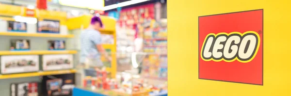 stock image Lviv, Ukraine - May 7, 2022 : Lego toy store with logo at yellow wall. Banner. Selective focus