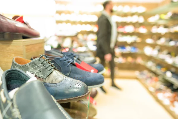 stock image Shelves with different footwear at shoes store - new shoes collection at secondhand store. Reselling concept. Shoes stall at secondhand store. Thrift shopping