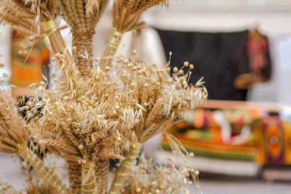 Didukh as a traditional Ukrainian Christmas symbol on souvenir market - sheaf of wheat used for celebrating Christmas in Ukraine. Ancient traditions concept, selective focus