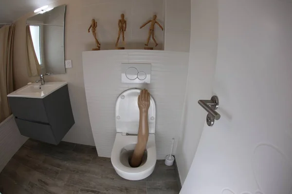 Wide Angle Shot Plastic Arm Sticking Out Toilet — 스톡 사진