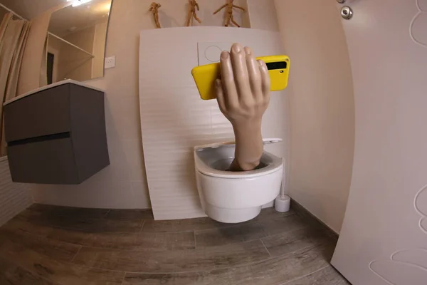 Wide Angle Shot Hand Smartphone Sticking Out Toilet Comedy Concept — 스톡 사진