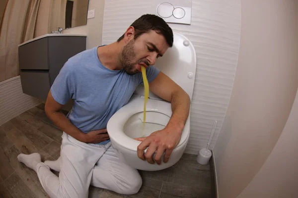 Wide Angle Shot Young Man Vomiting Toilet — Stock fotografie