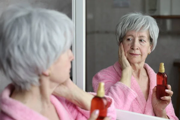 Close Portrait Mature Woman Doing Skincare Routine Front Mirror Bathroom — Stock Photo, Image