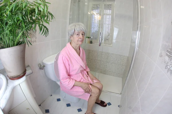 Wide Angle Shot Senior Woman Sitting Toilet — Stock Photo, Image