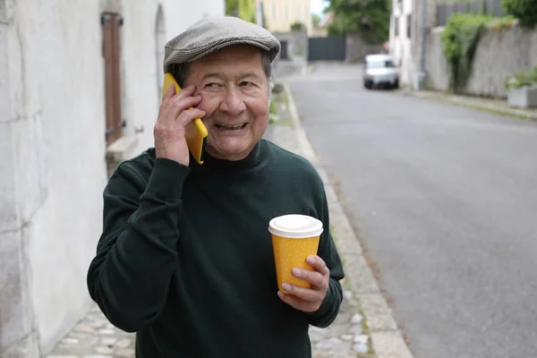 stock image portrait of handsome senior man in stylish clothes on city street