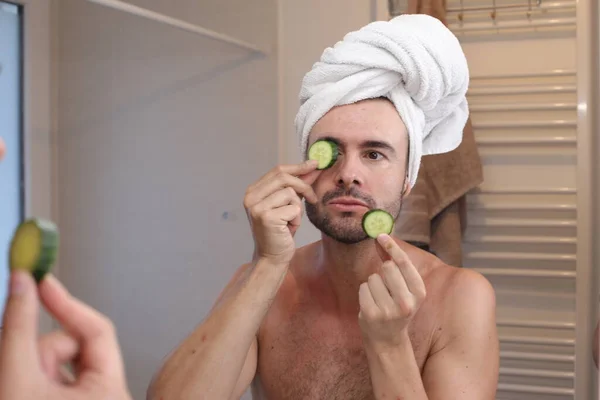 Portrait Young Man Towel Head Cucumbers Eyes Front Mirror Bathroom — Stock Photo, Image
