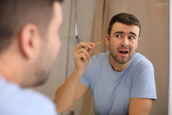 Portrait Handsome Young Man Cleaning Ears Front Mirror Bathroom — Stock Photo, Image