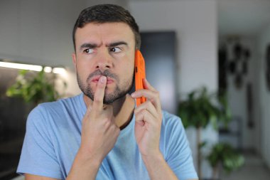 Man getting a suspicious phone call clipart