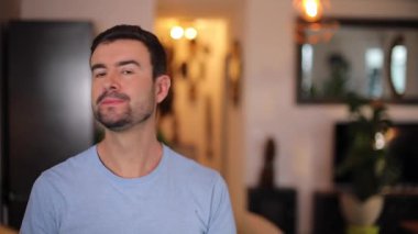 portrait of handsome man in the living room at home