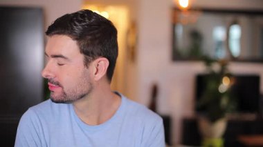 portrait of handsome man in the living room at home