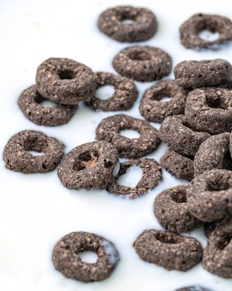 Chocolate flakes in milk in the form of rings close-up
