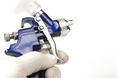 blue color paint gun on a white background close-up
