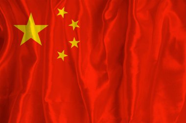İpek arka planda Çin bayrağı büyük bir ulusal semboldür. Kumaş dokusu Ülkenin resmi devlet sembolü.