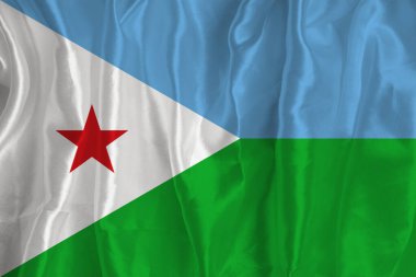 The flag of Djibouti on a silk background is a great national symbol. Fabric texture The official state symbol of the country..