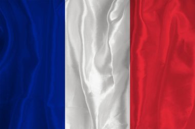 The flag of France on a silk background is a great national symbol. Texture of fabrics The official state symbol of the country.