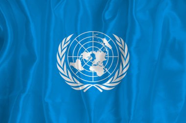 Flag of the World Meteorological Organization on a silk background Fabric texture Official state symbol of countries