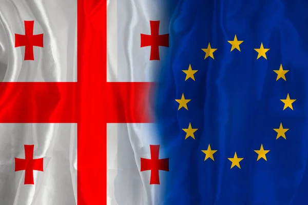 Georgian flag and EU flag. Flag of the country of Georgia and the European Union together. Conceptual image of Georgia and the European Union.