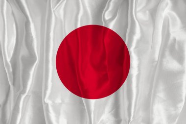 İpek arka planda Japon bayrağı büyük bir ulusal semboldür. Kumaş dokusu Ülkenin resmi devlet sembolü