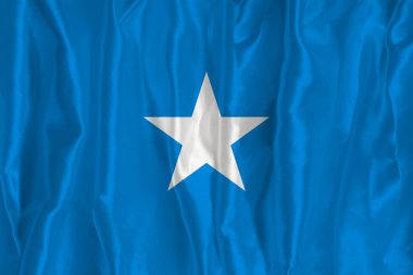 İpek arka planda Somali bayrağı büyük bir ulusal semboldür. Kumaş dokusu Ülkenin resmi devlet sembolü