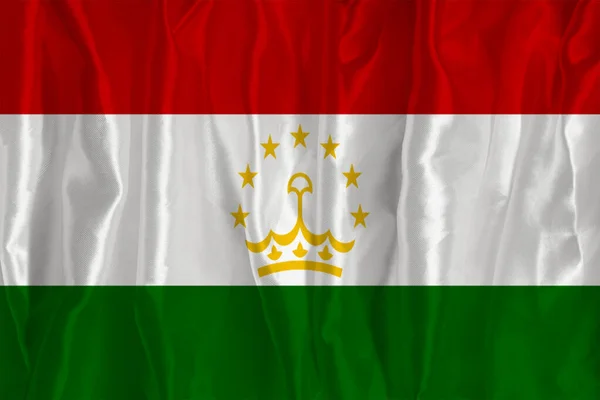 絹の背景にタジキスタンの国旗が描かれており 国のシンボルとなっている 生地の質感国の公式シンボル — ストック写真