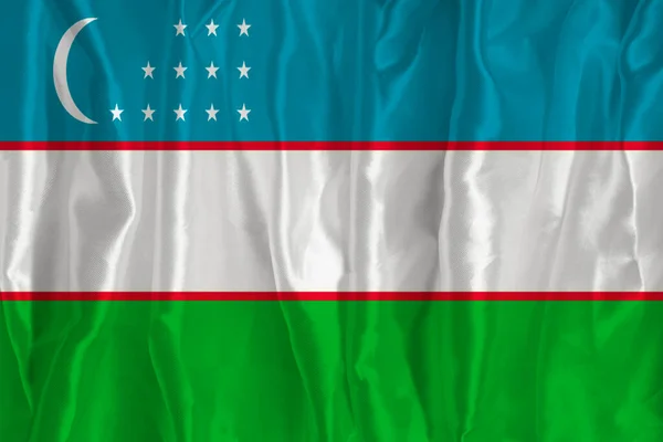 Vlajka Uzbekistánu Hedvábném Pozadí Skvělým Národním Symbolem Textura Tkanin Oficiální — Stock fotografie