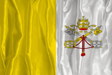 İpek arka planda Vatikan bayrağı büyük bir ulusal semboldür. Kumaş dokusu Ülkenin resmi devlet sembolü