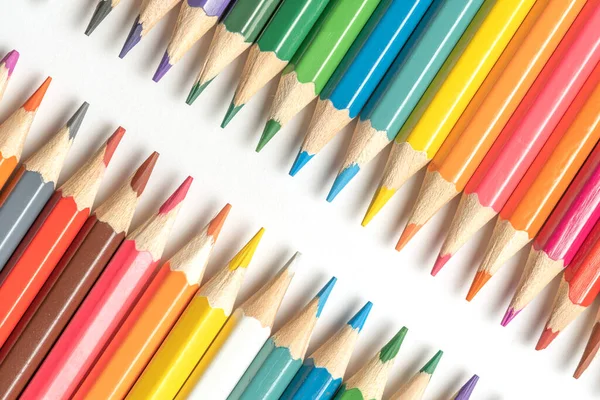 stock image Colored pencils lie in a row. A line drawn with pencil tips. Set of crayons for illustrations, art, study. Ready for school.