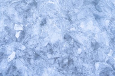 Buzlu kış arka planı grunge dokusunu çatlatmış. Buz pateni pistindeki doğal çizikler kış kompozisyonu için bir doku ya da arka plan, büyük uzun boyama