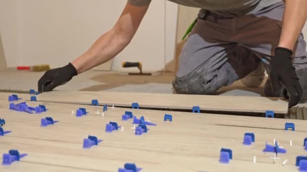 Tiler Lays Floor Tiles Floor Porcelain Tiles Kitchen Tiler Gluing — Stock Video