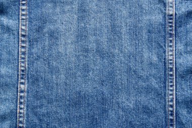 Mavi kot pantolon kumaş arka plan dokusu. Arka plan kot dokusu. Kot pantolonun kumaşı mavi renkte. Manzarayı kapat. Düz arkaplan.